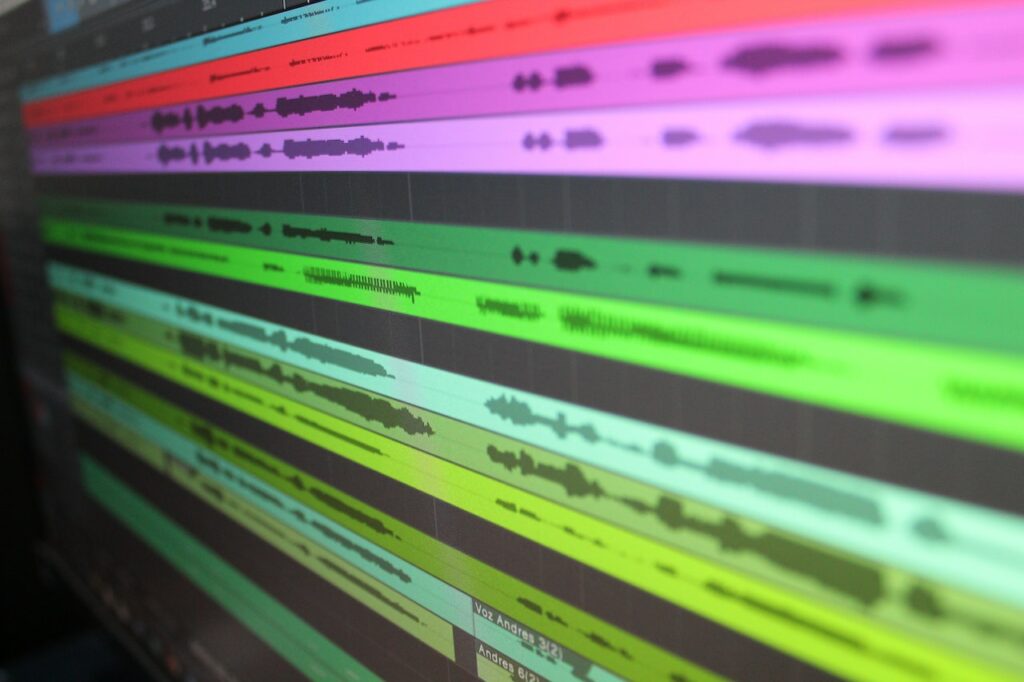 An audio mixing program displaying several audio waveforms.