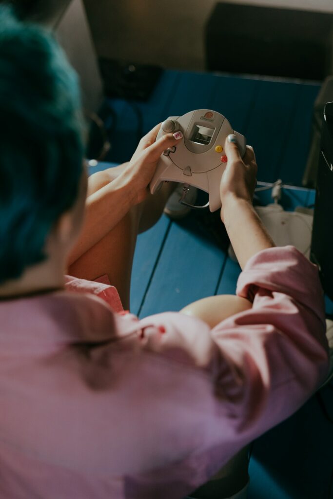 A man playing video games on his Dreamcast.