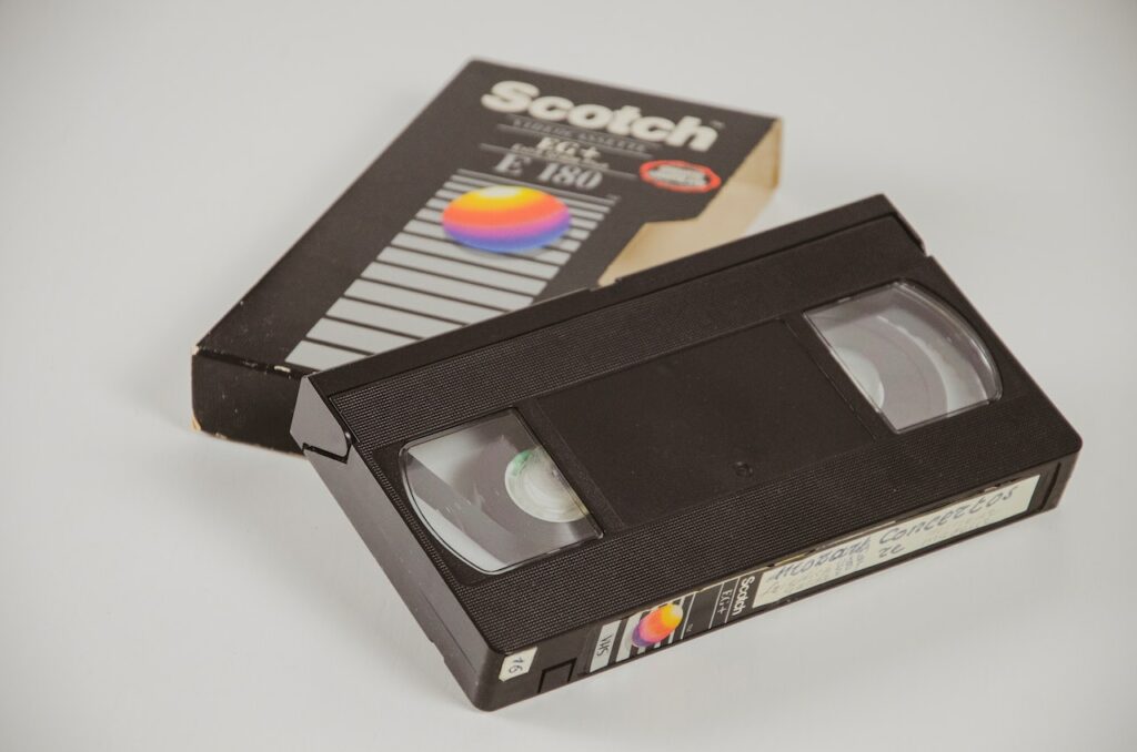 A Scotch VHS tape beside its case.
