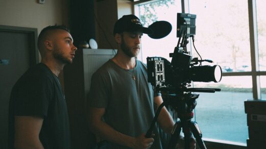 Two filmmakers working a camera.