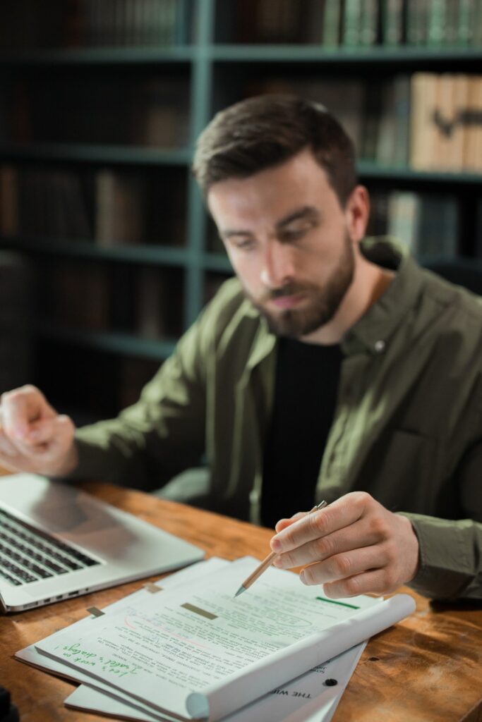 A writer writing and editing a script for a film.