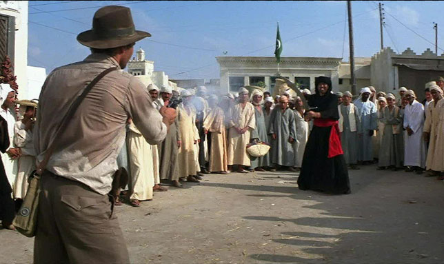 Indiana Jones shooting a swordfighter in "Raiders of the Lost Ark"
