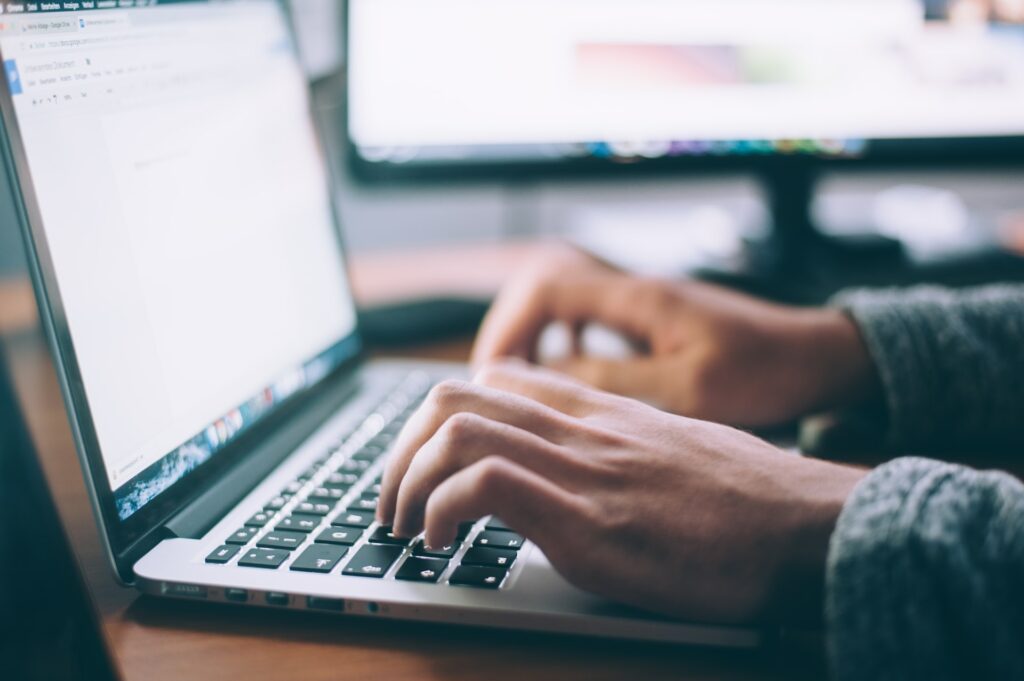 A person working on a film script on their laptop.