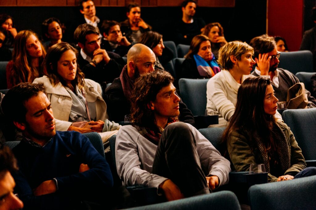 An audience watching a non-linear movie.