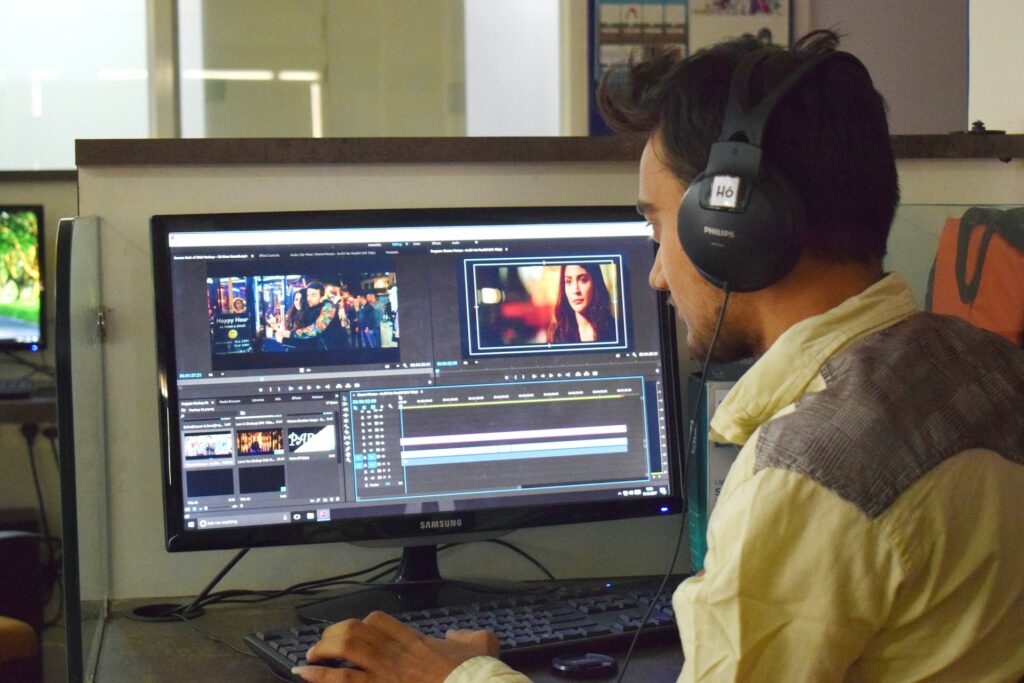A man working with video editing software.