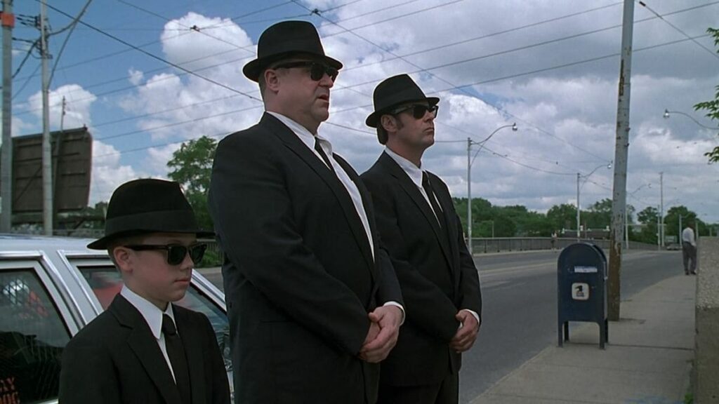 A few characters from "Blues Brothers 2000", one of the worst Hollywood sequels, standing beside one another.