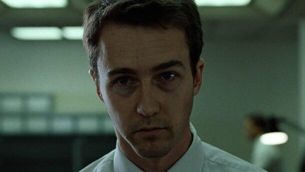 The narrator from the film "Fight Club" staring ahead at the viewer.