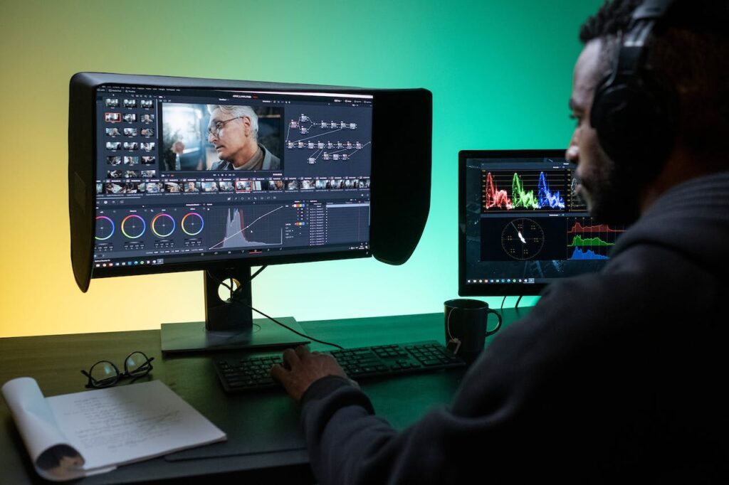 A man editing films on his computer.