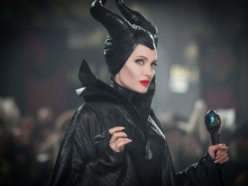 Maleficent, one of Disney's famous antagonists posing with a staff in her hand.