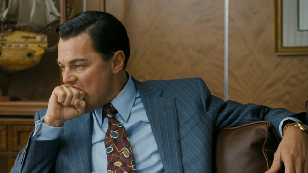 Leonardo DiCaprio as seen in the Martin Scorsese film "The Wolf of Wall Street" biting his knuckles.