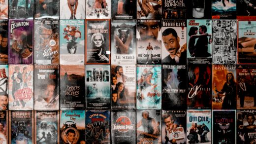 A wall filled with different film posters.