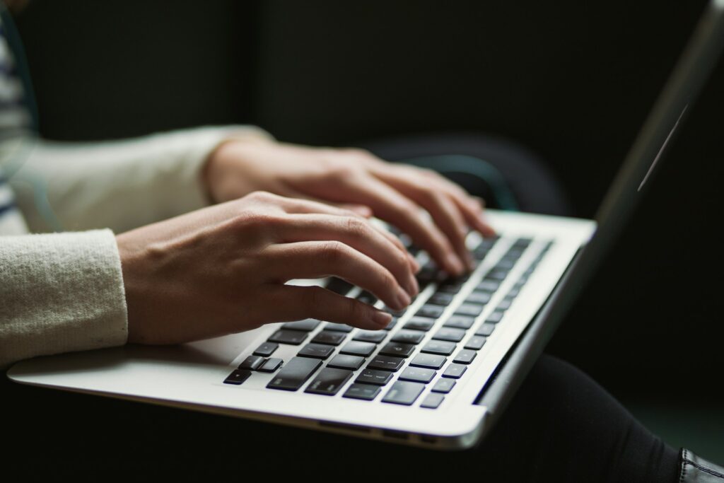 A person typing on a keyboard.