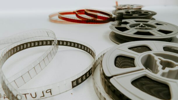 A series of film reels laying beside one another.